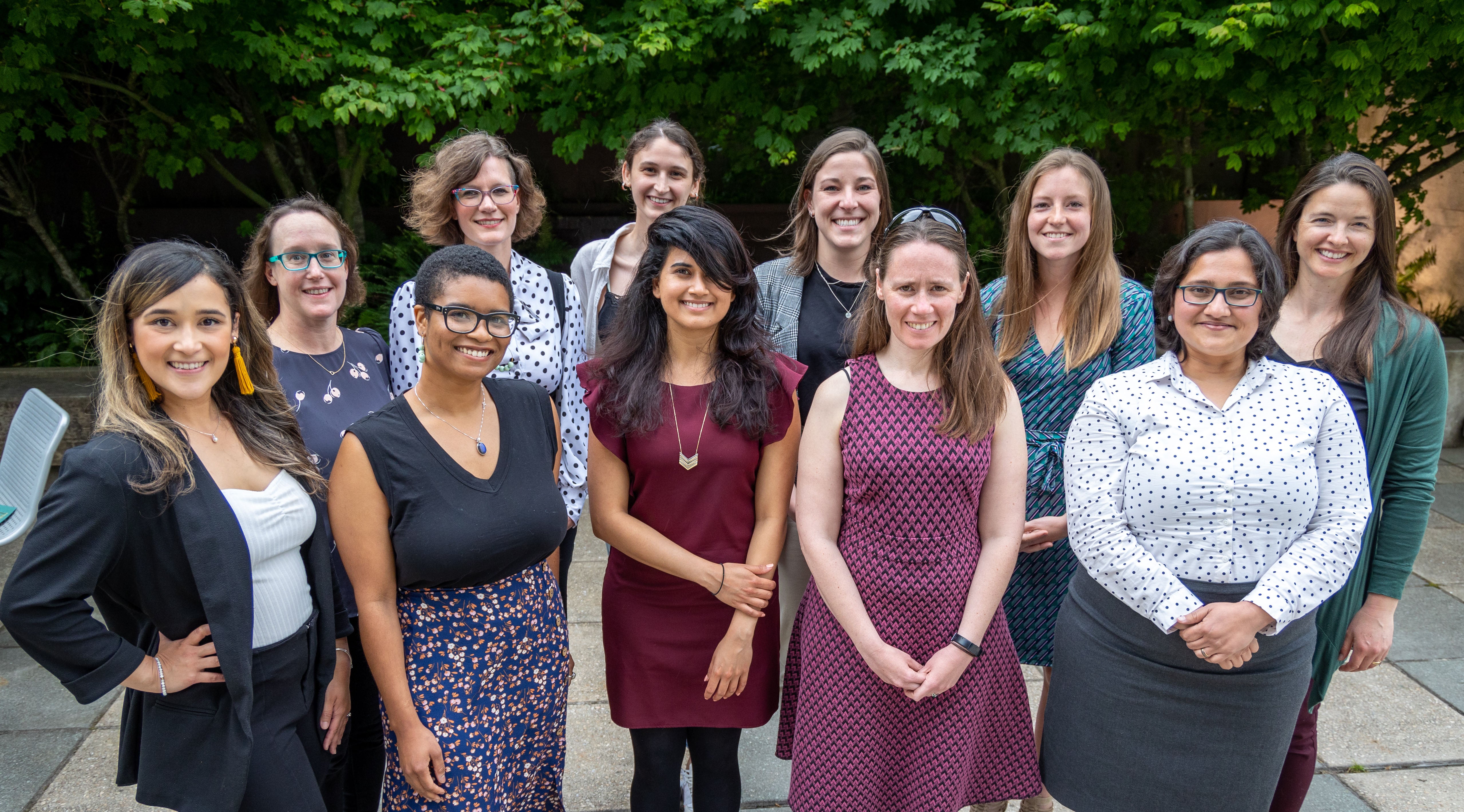 Participants of the women's innovation network stand facing the camera.