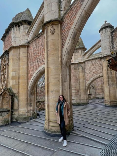 Gabriela Chitwood posing on top of of the Toulouse Cathedral in France.